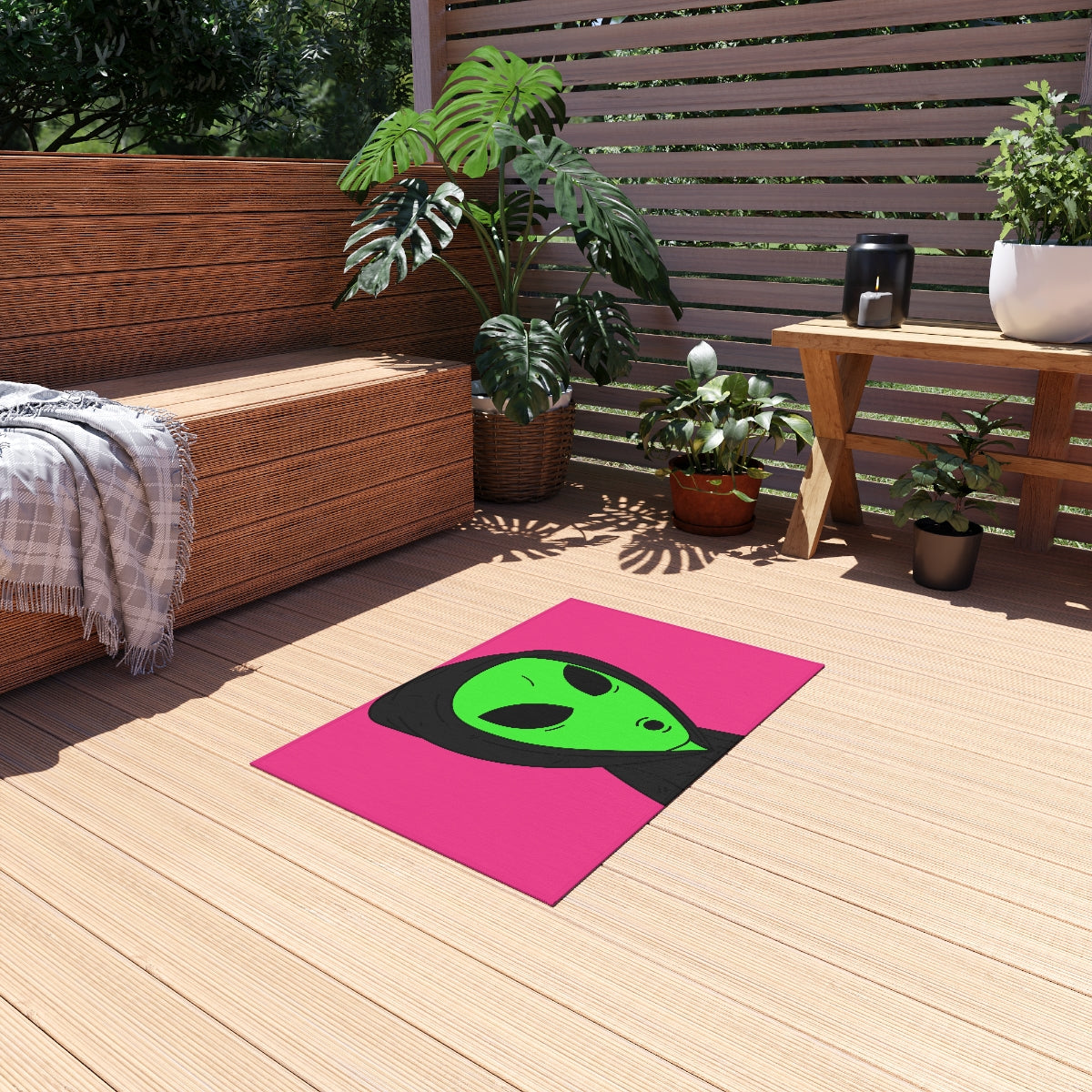 The Visitor Green Alien Black Hoodie Pink Background Outdoor Rug